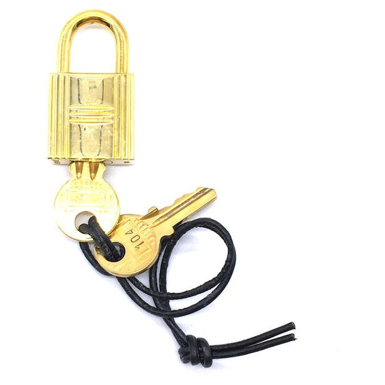 Hermès Gold Birkin Bolide Kelly Polished Plated Lock 2 Keys #104 Golden  Metal ref.543880 - Joli Closet