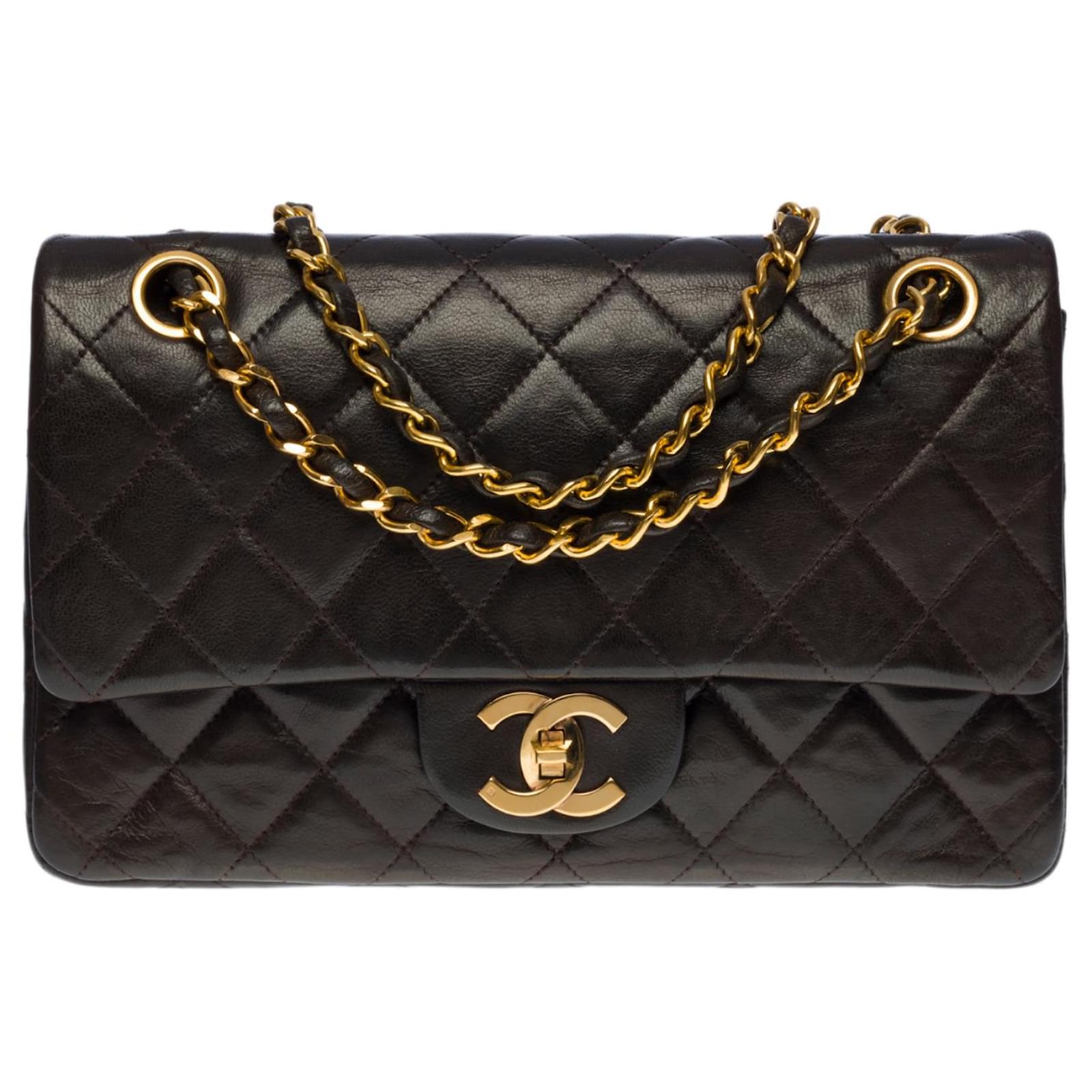 The coveted Chanel Timeless bag 22 cm with lined flap in dark brown ...