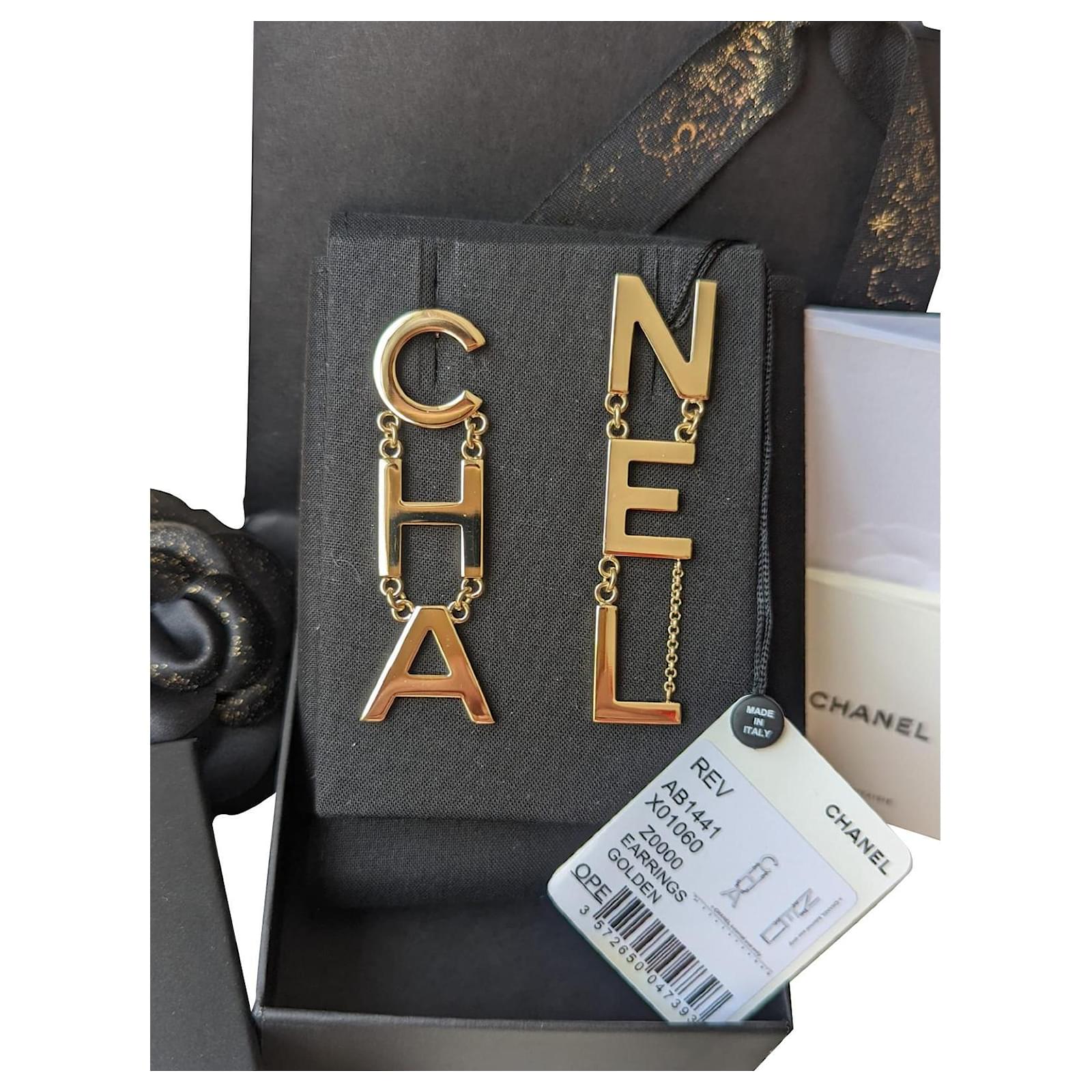 Chanel CHA NEL Runway Logo B20V Drop Letter Earrings Box RARE Golden Metal  ref.439225 - Joli Closet