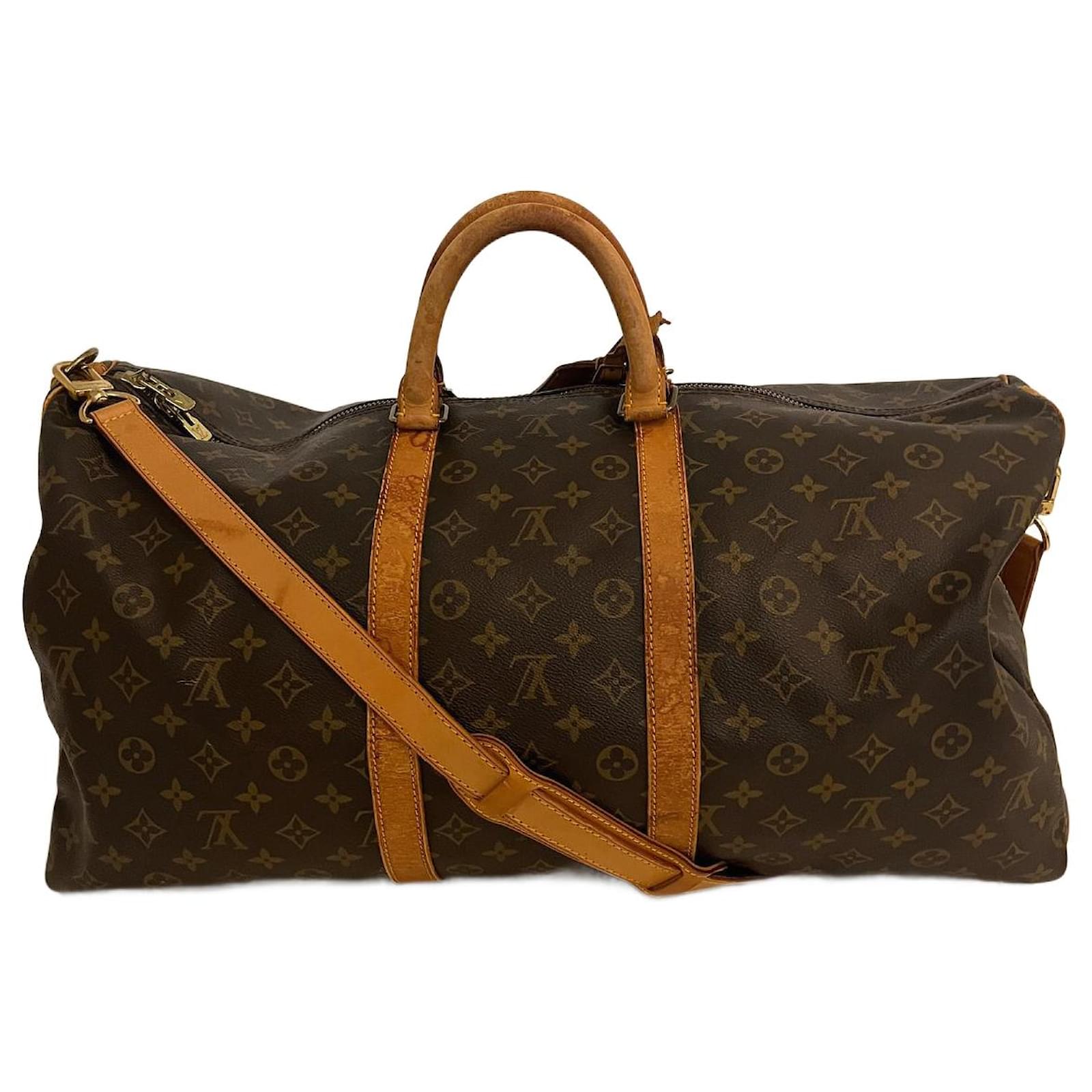 Louis Vuitton, Louis Vuitton coated canvas Vachetta leather keepall.  Condition: Authentic