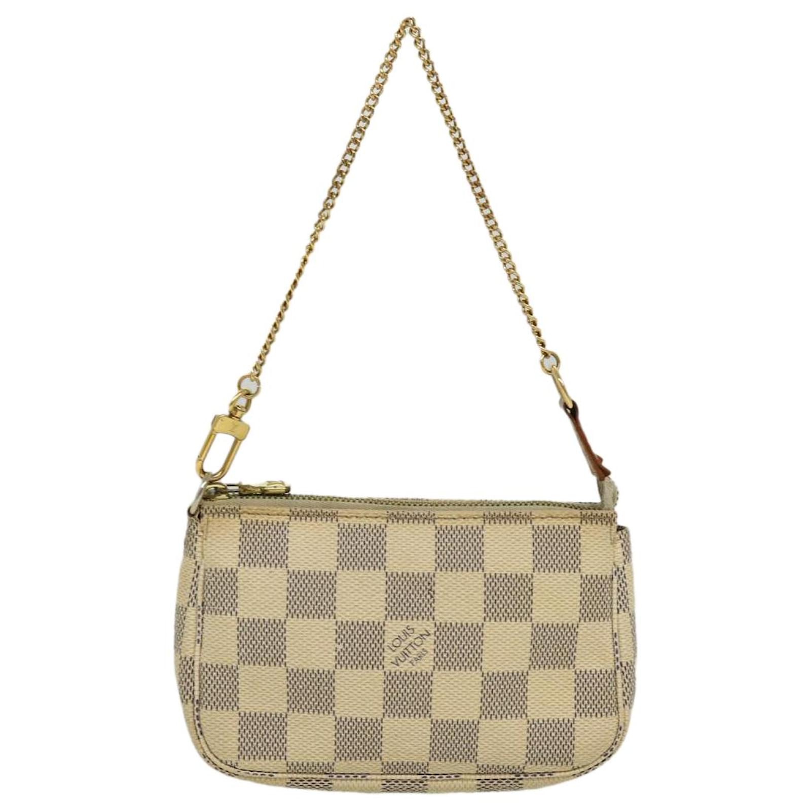 Pochette accessoire cloth handbag Louis Vuitton Beige in Cloth