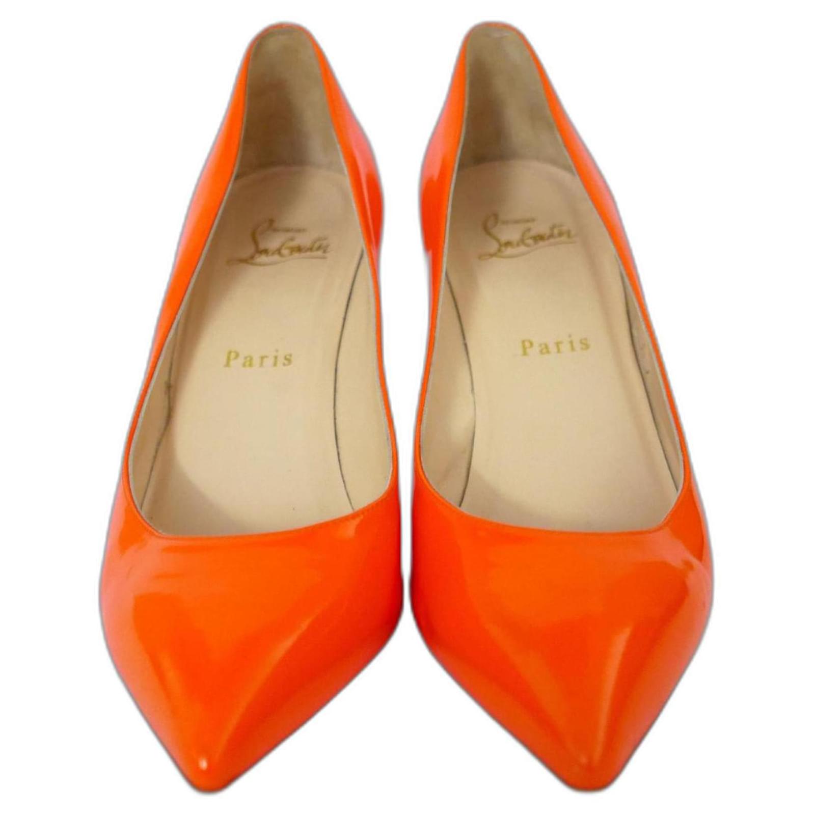 Christian Louboutin neon orange patent leather pumps