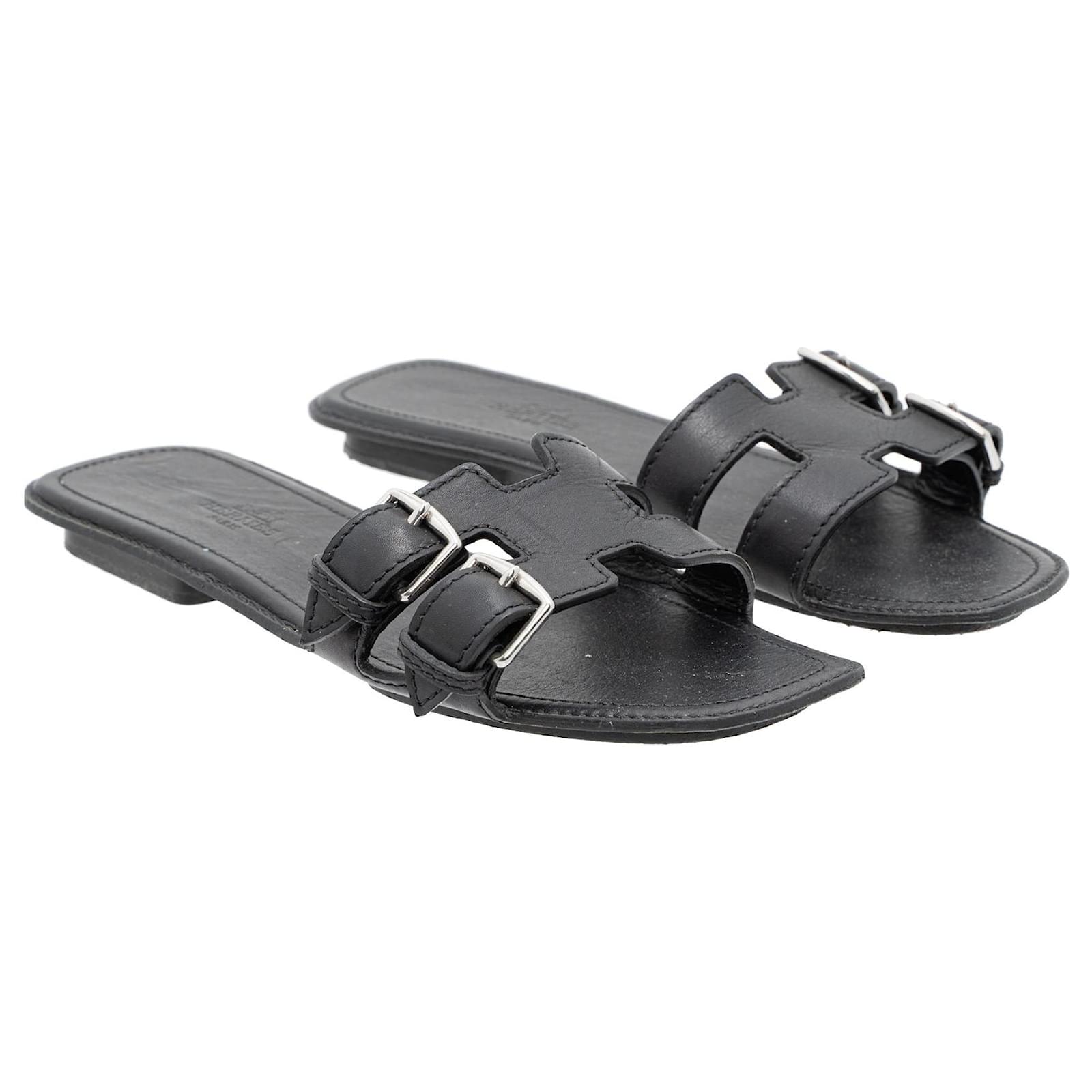 Hermès Sandales plates en cuir à boucle latérale Noir ref.741113 Joli