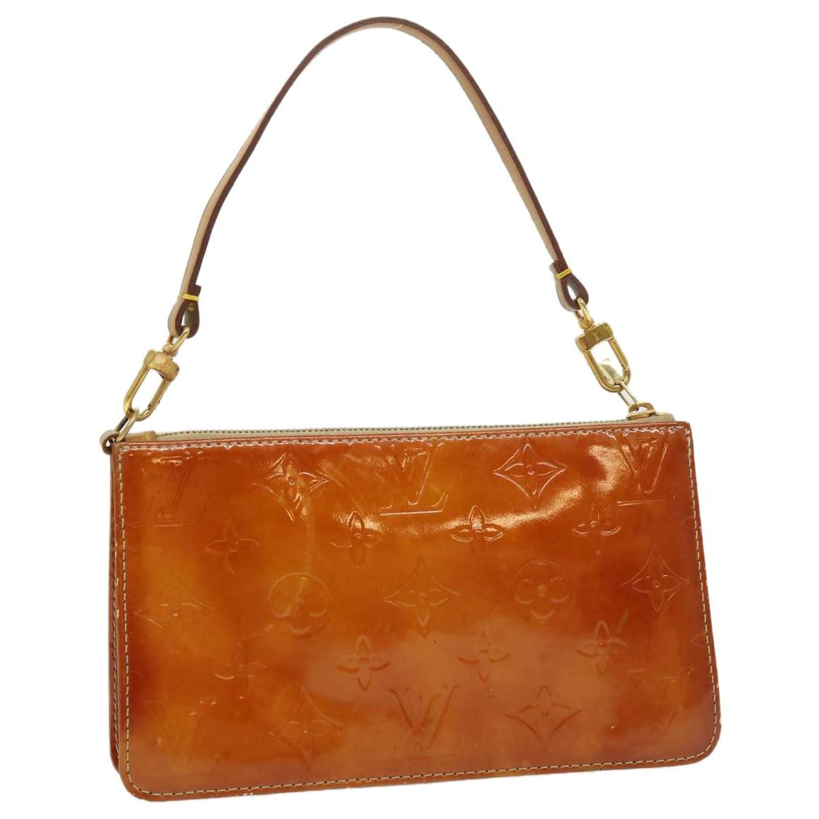 Pochette Accessoire patent leather handbag