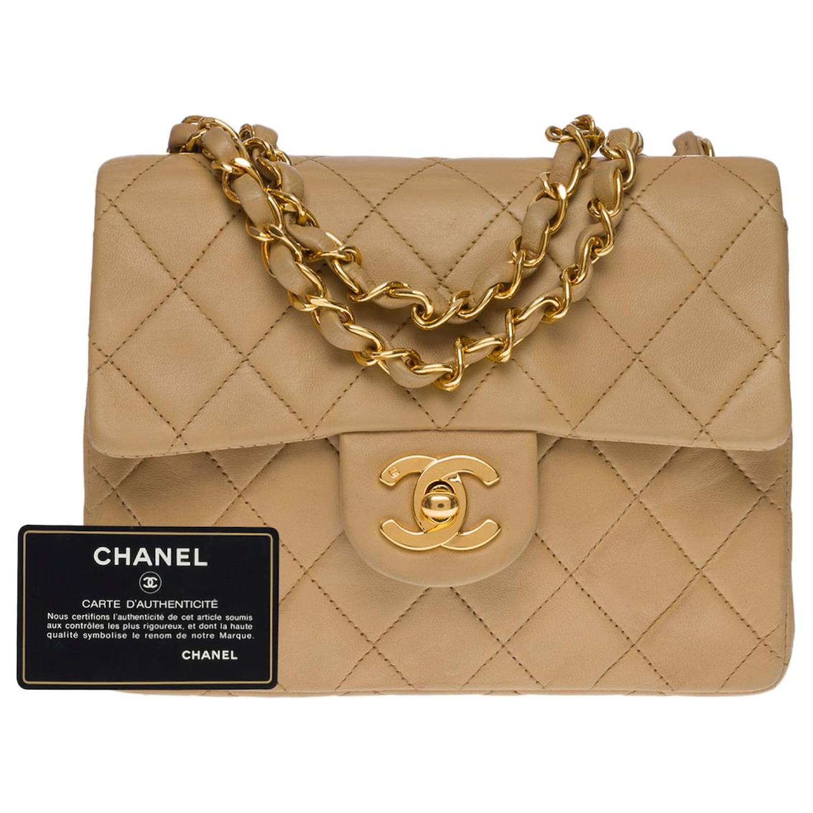 Vintage Chanel classic mini flap bag with leather strap and gold hardware