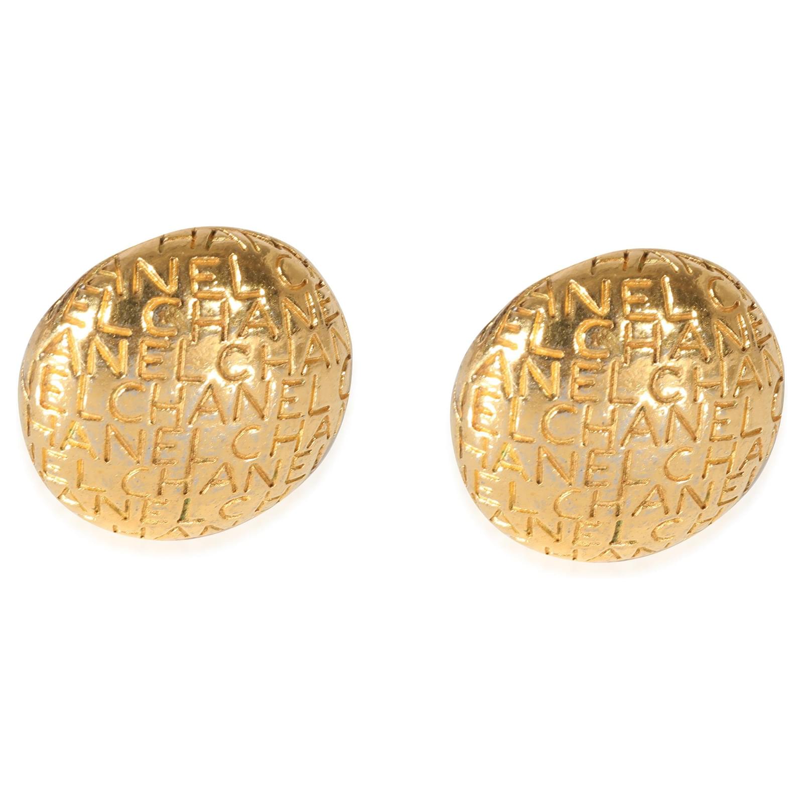 Gold Tone Chanel Vintage Logo Lettering Button Earrings Red Metal  ref.932322 - Joli Closet