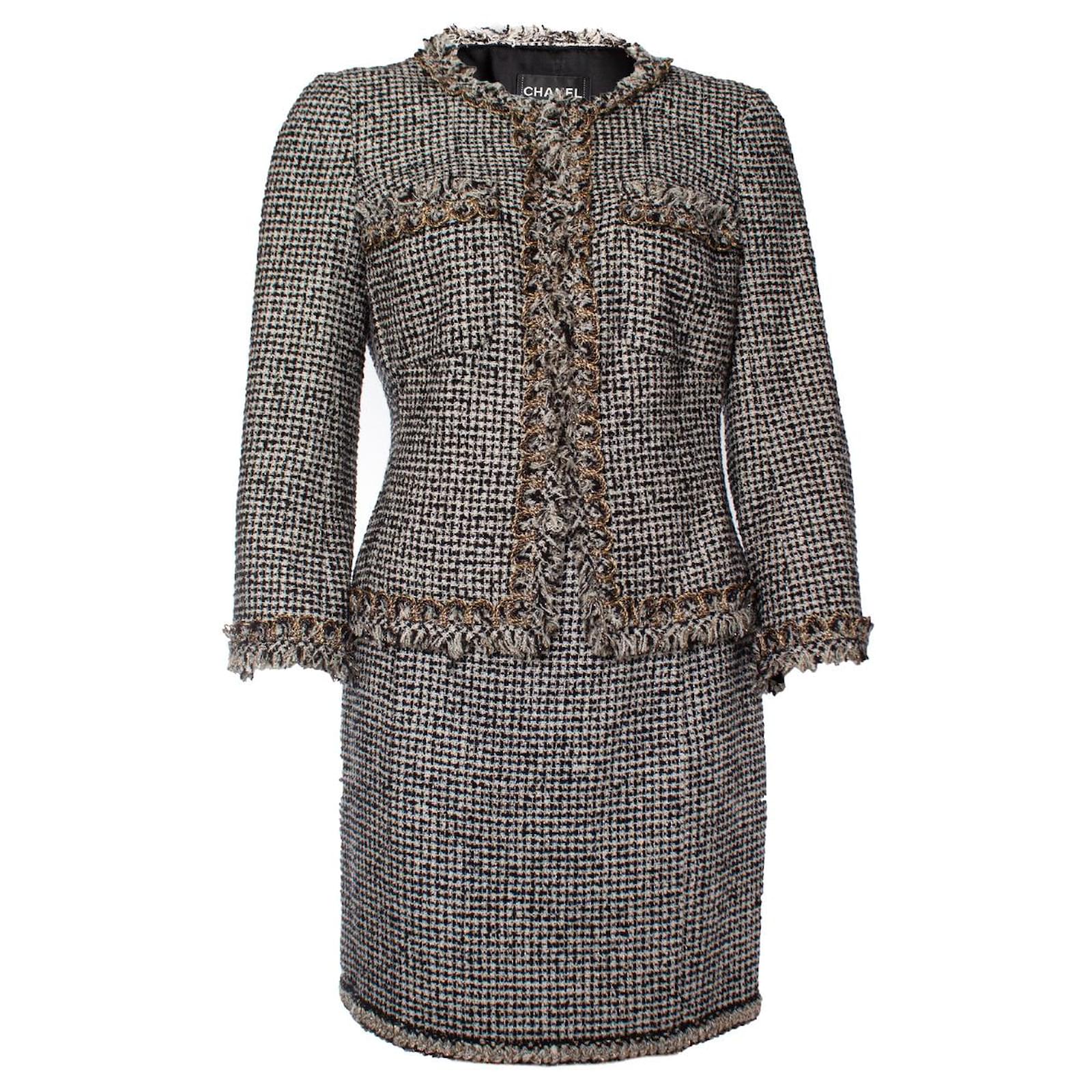 Vintage Chanel black-white tweed wool coat with zipper details.
