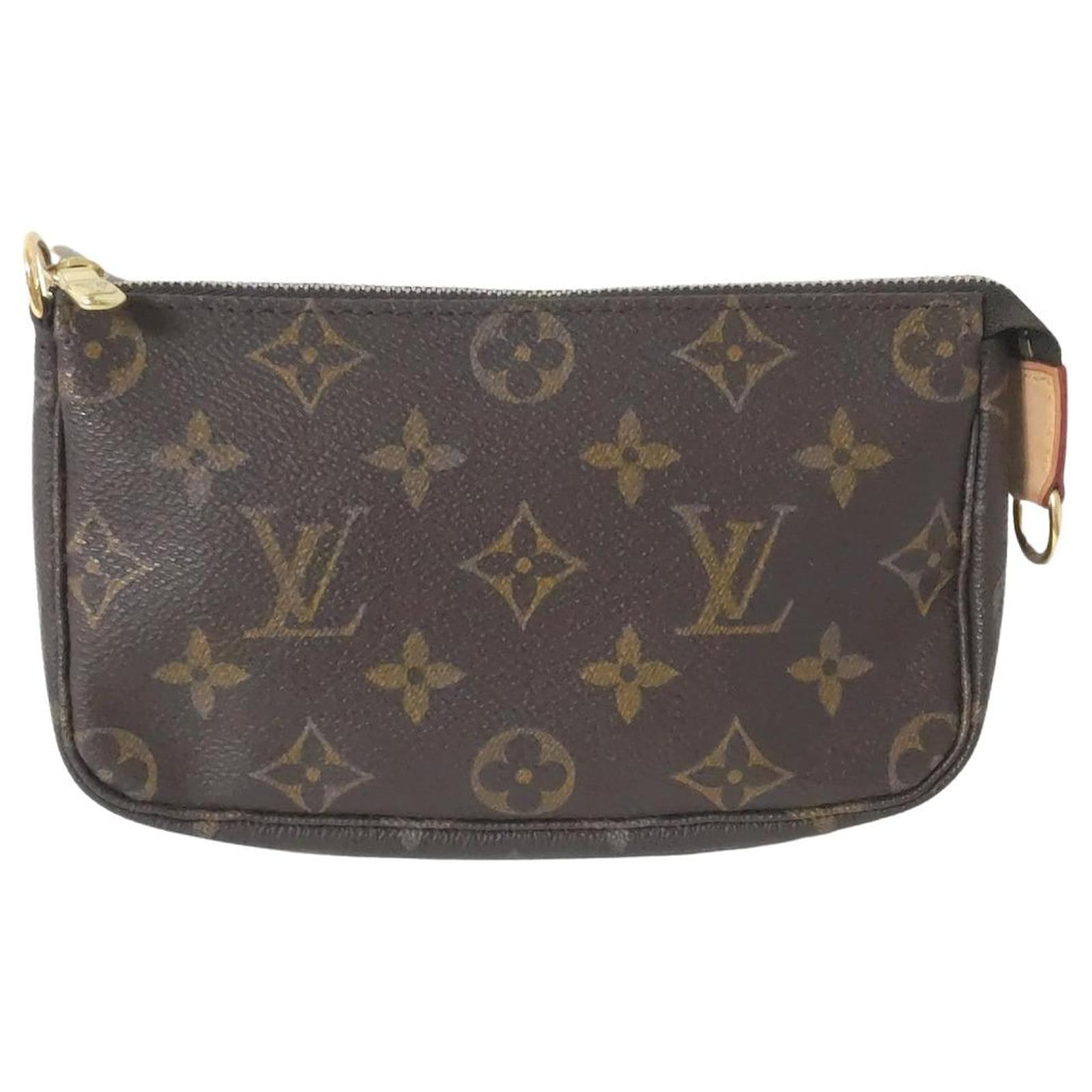 Pochette accessoire cloth handbag Louis Vuitton Brown in Cloth