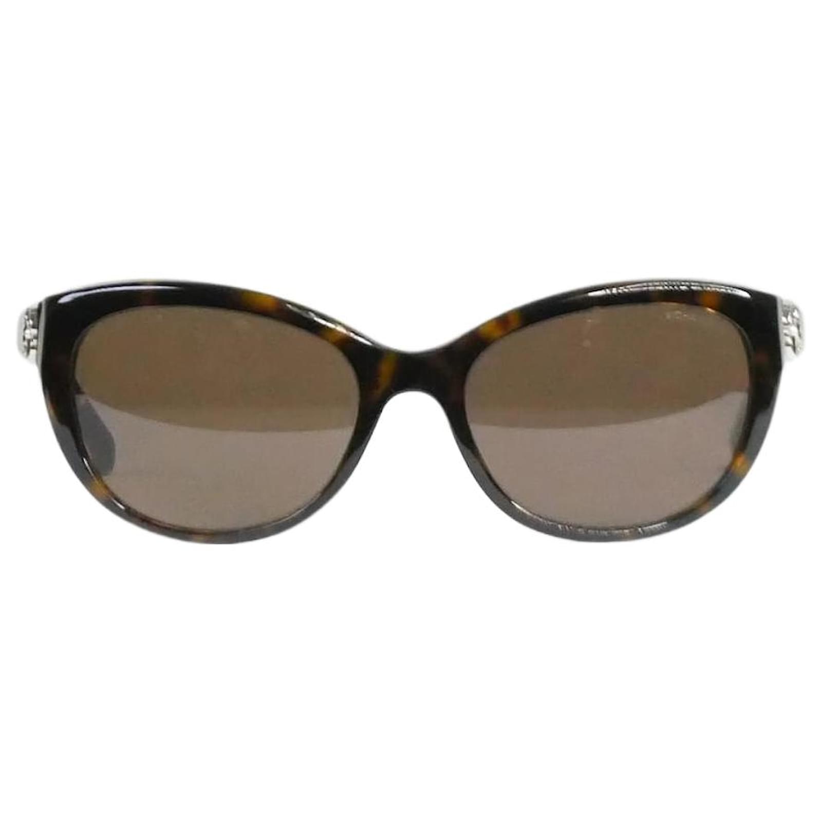 Chanel Brown tortoise shell sunglasses with flower detail at temple  ref.1021520 - Joli Closet