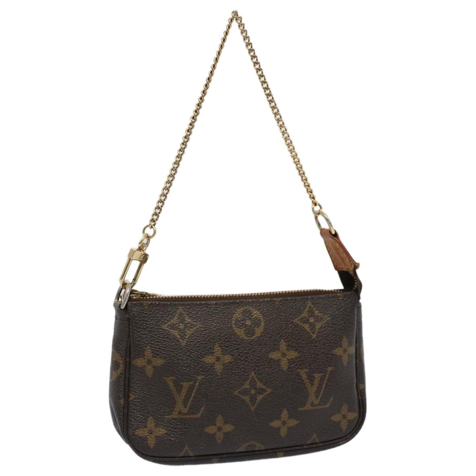 Pochette accessoire cloth handbag Louis Vuitton Brown in Cloth