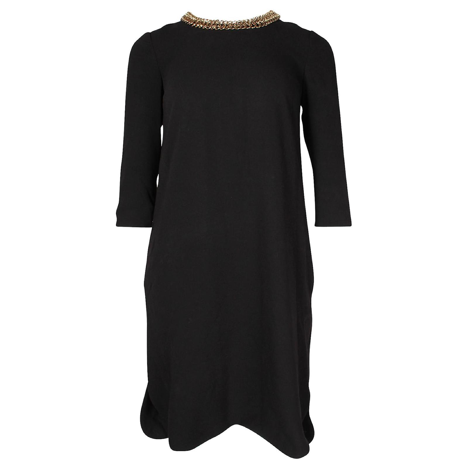 feather gold dress Golden feather beaded dress with a structured winged collar main image 0