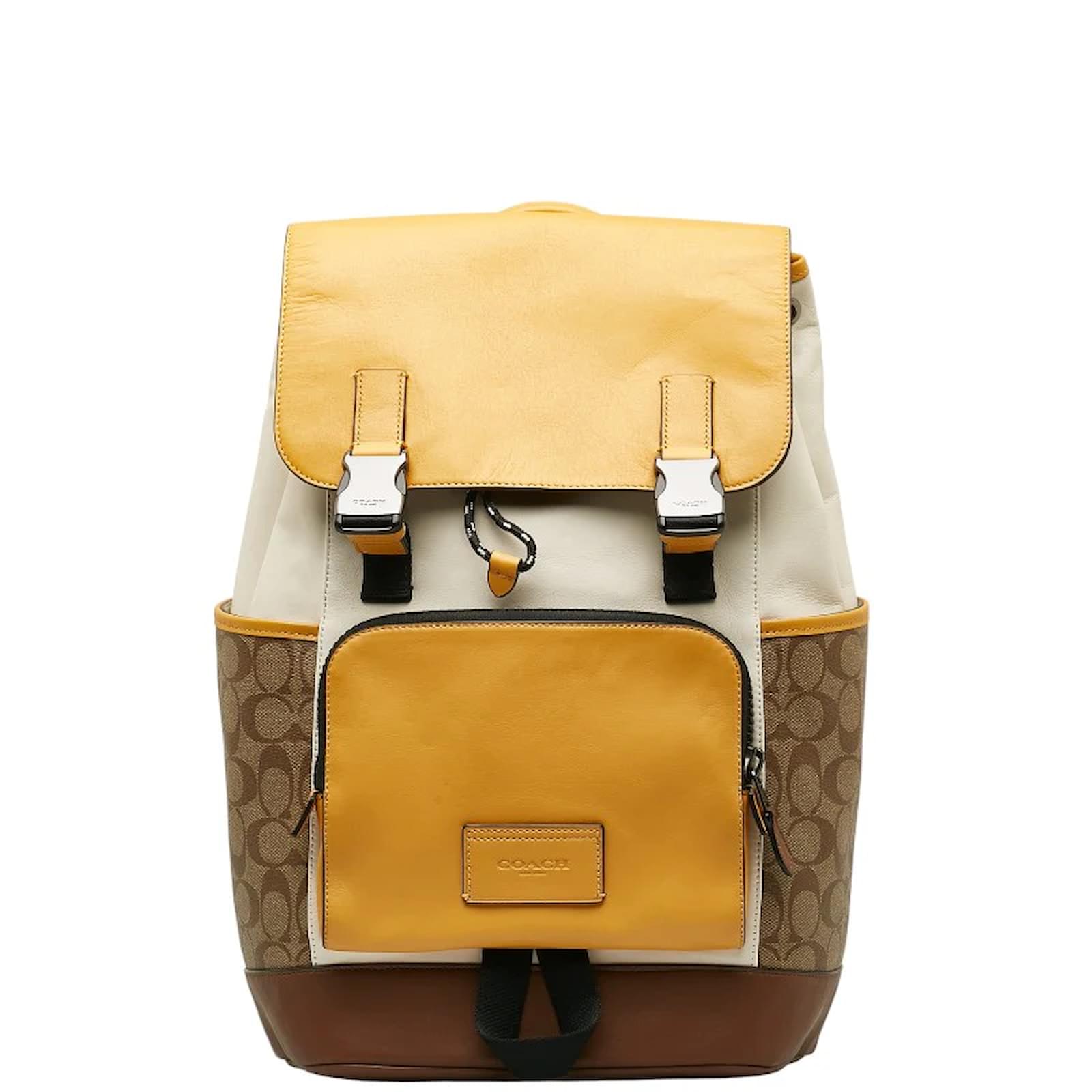 Coach yellow top backpacks