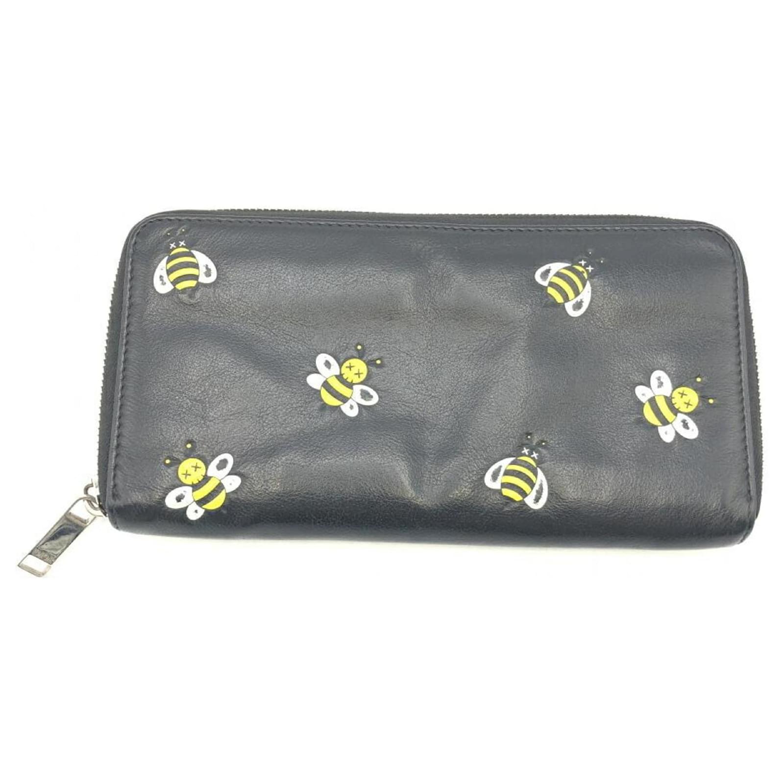 Dior kaws bee wallet best sale