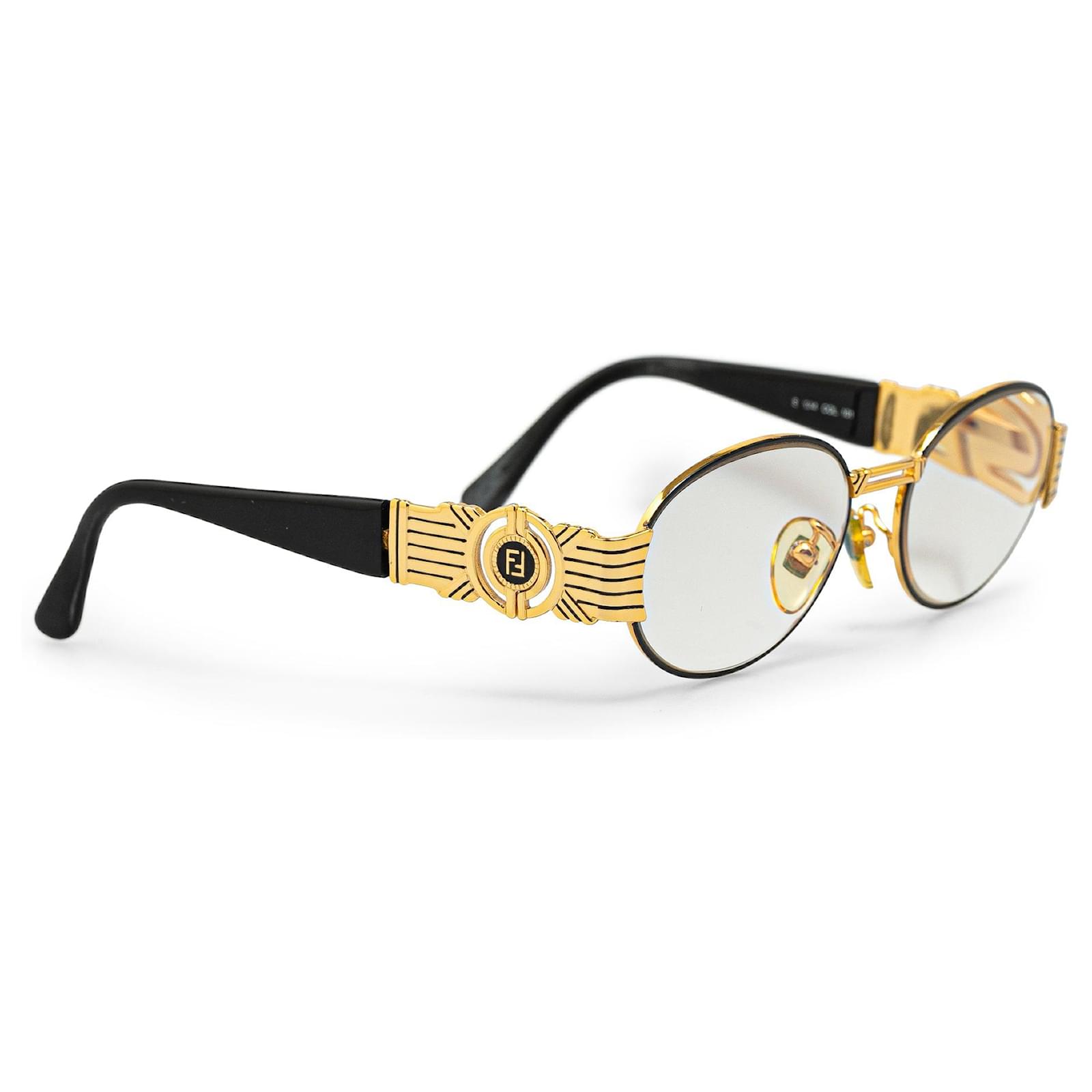 Occhiali da sole ovali Fendi in oro D'oro Joli Closet